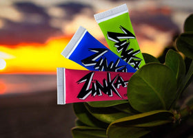 Zinka nosecoat in beach setting showing brand resisting water and sweat