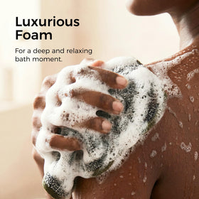 ZOMCHI towel held in hand illustrating size and easy handling for body and face